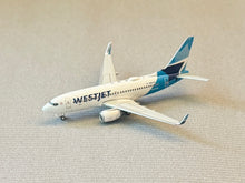 Load image into Gallery viewer, Gemini Jets 1/400 Westjet Airlines Canada Boeing 737-700 C-GWJO
