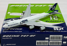 Load image into Gallery viewer, HX Models 1/400 Boeing 747-8F Seattle Seahawks Colour N841BA flaps down B631007F
