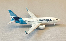 Load image into Gallery viewer, Gemini Jets 1/400 Westjet Airlines Canada Boeing 737-700 C-GWJO
