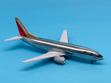 Load image into Gallery viewer, JC Wings 1/200 Southwest Airlines Boeing 737-300 Silver One Polished N629SW

