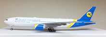 Load image into Gallery viewer, JC Wings 1/200 Ukraine International Airways Boeing 777-200ER UR-GOA LH2120
