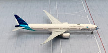 Load image into Gallery viewer, JC Wings 1/400 Garuda Indonesia Boeing 777-300ER Ayo Pakai Masker PK-GIJ
